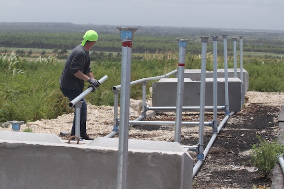 Installing solar panels for Sustainable Generation's Advanced Composting System